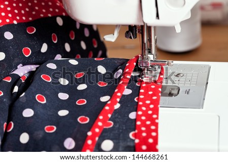 sewing clothes on sewing machine close up
