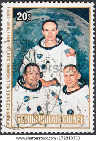 REPUBLIC OF GUINEA - CIRCA 1979: A postage stamp printed in the Republic of Guinea shows Apollo 11 Moon Landing and first step on The Moon surface - portrait Armstrong, Collins, Aldrin, circa 1979