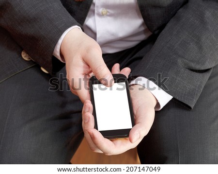 above view of smartphone with cut out screen in businessman hand