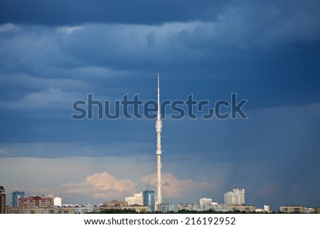 dark blue rainy clouds over TV tower in summer evening, Moscow
