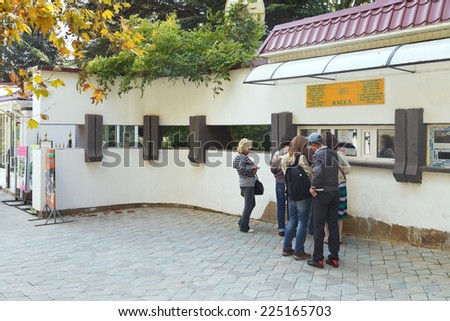 YALTA, RUSSIA - OCTOBER 2, 2014: tourists near ticket office of nikitsky botanical garden, Crimea. The garden was founded in 1812 by its first director botanist Christian Steven