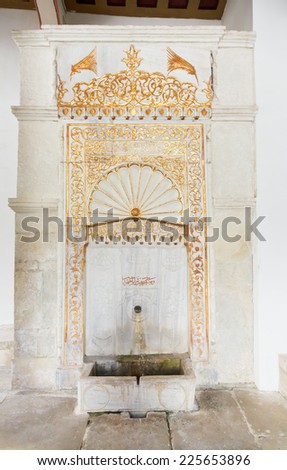 BAKHCHYSARAI, RUSSIA - OCTOBER 1, 2014: marble Golden Fountain in Khan\'s Palace (Hansaray) in Bakhchisaray. The palace was built in 16th cent. and became home for Crimean Tatar Khans