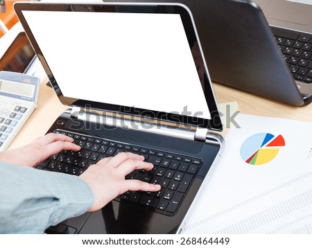 business workflow - businessman runs with laptop with cut out screen at office desk
