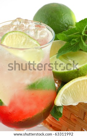 Fresh cocktail with a lime , mint and ice on a white background