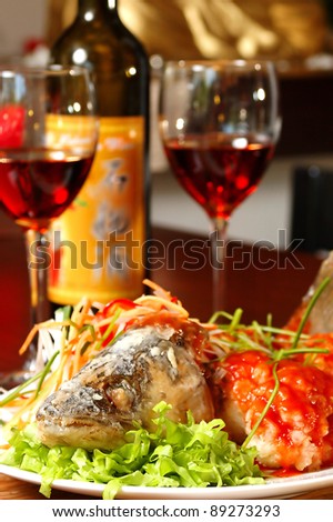 prepared fish with red wine on a table at restaurant