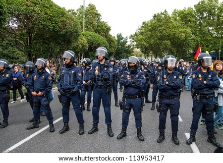 MADRID - SEPT. 25: Spanish Police by closing the street to the Congress building during the Protests in Spain against the Spanish economic crisis and political system in Madrid on Sep 25 2012