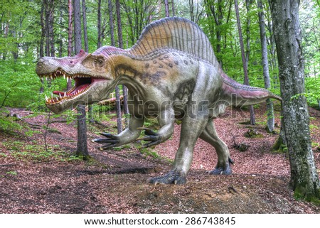 BRASOV, ROMANIA - JUNE 2015: Real-sized dinosaurs at Rasnov Dino Park, Brasov, Romania on June 2015.  The park recreates the lost world of dinosaurs.