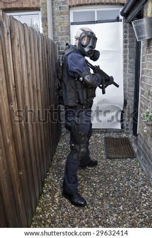 police officer with machine gun