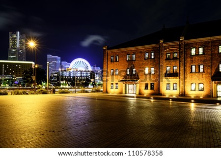 Modern City night scene. Yokohama City at night viewed from Red Brick Warehouse Park.