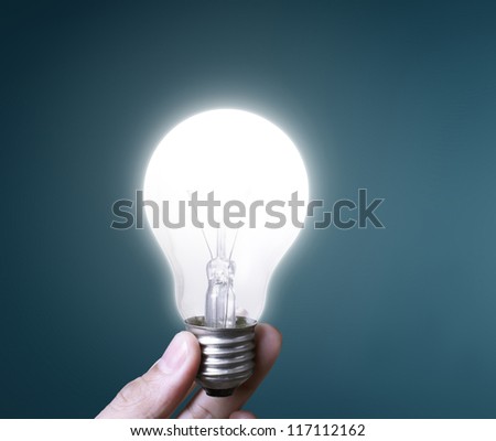 Light bulb in hand businessman
