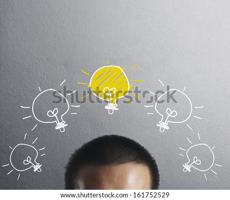 Businessman with an idea, drawn light bulb