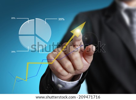 business man pointing at growth graph and business concept