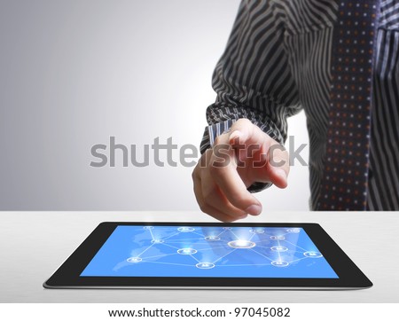 hands are pointing on touch screen ,touch-pad
