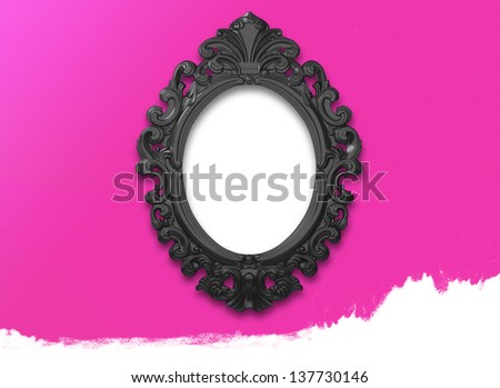 empty Vintage black ornate frame  on pink wall