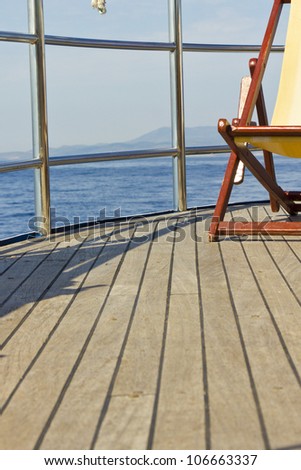 Deck of a ship with part of a sun chair