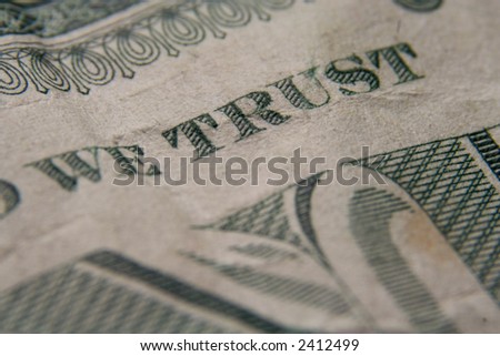 A macro close up of a US dollar bill. Focusing in one the words..\