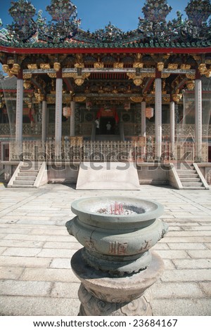 Chinese temple altar on blurring of the temple itself.