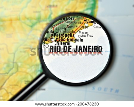 Close up of Rio de Janiero under a magnifying glass on a map