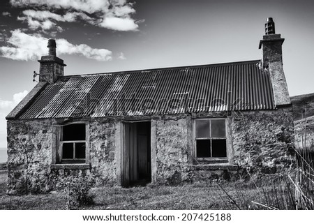 Traditional Scottish 2 rooms stone built croft house or black house . Photographed at 57Ã?Â° 48\' 50.54\