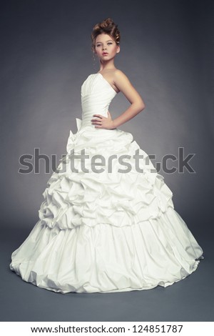 Girl princess in white ball gown on black background