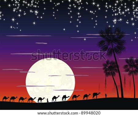 caravan of camels in the desert near the mosque under the moon