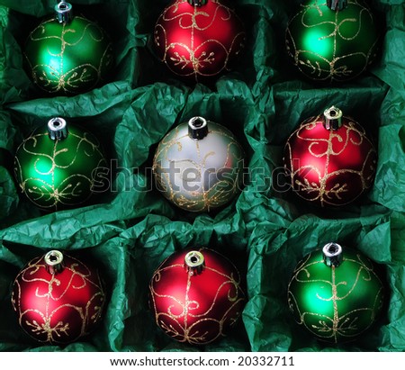 open box of christmas baubles ready to be hung on tree