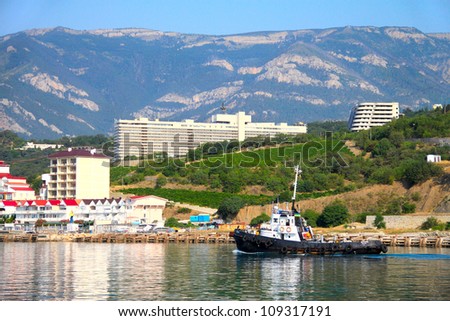 The yacht, the mountains and the sea. The Crimean landscape. Yalta, Ukraine.