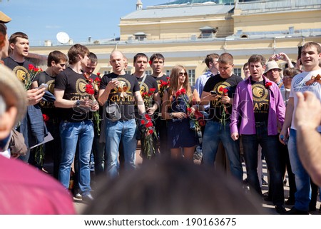 MOSCOW, RUSSIA - MAY 9: Young people congratulate war veterans on Victory Day, sing a song, May 9, 2013 in Moscow, Russia