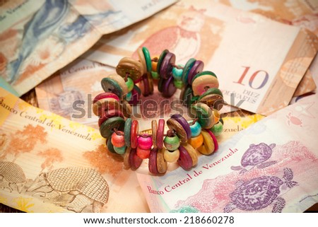 The national currency of Venezuela, Latin America. Colorful handmade bracelet