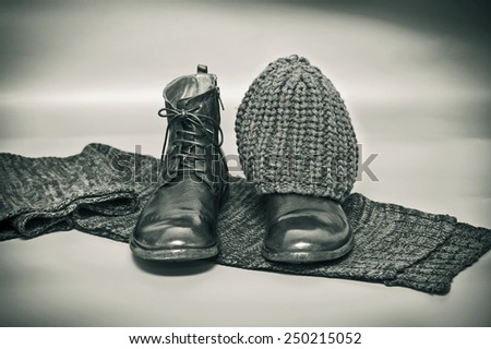 Fashion leather shoes, knitted scarf and hat. still life of garments