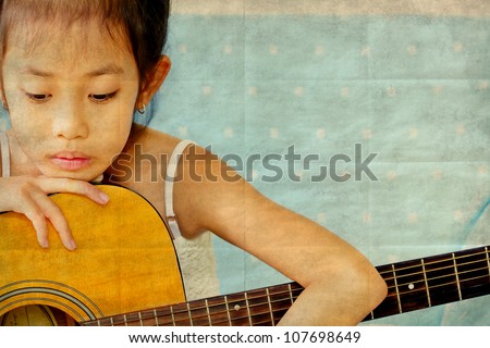 School girl with guitar on a holiday and relaxing,retro style