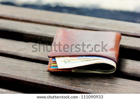 Lost wallet on a chair in the garden