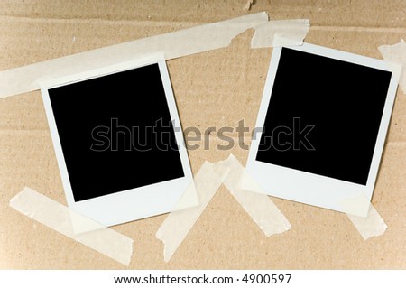 Two  instant photographs attached with masking tape to a cardboard box, with path for each frame