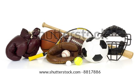 Variety of sports equipment on white background with copy space, items inlcude boxing gloves, a basketball, a soccer ball, a football,