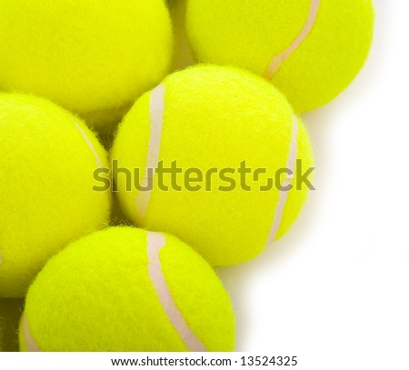 Several tennis balls on a white background with copy space