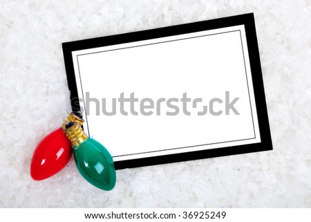 A blank white note card or invitation or greeting card with copy space included Christmas lights