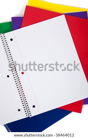 multi colored folders with  a blank notebook on a white background
