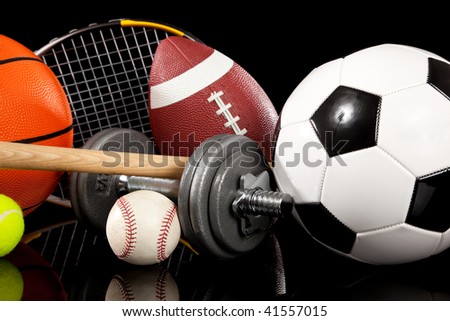Assorted sports equipment including a basketball, soccer ball, tennis ball, bat, tennis racket,  football, dumbbells and baseball