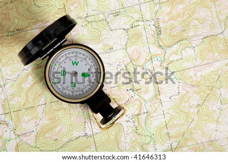 A compass on a topographical map