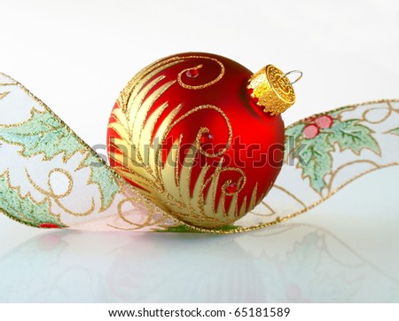 Red Christmas ball with a curly ribbon