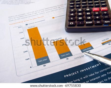 Pen on the project investment chart with calculator