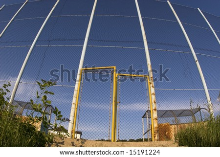 Wire fence and gate of local football  playground.