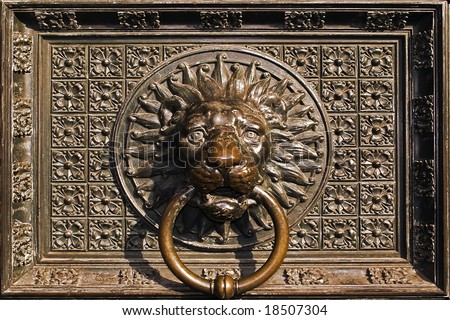 Lion head ornament on old cathedral door.