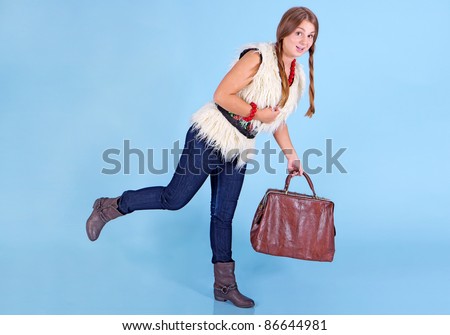 Young girl with bag in jeans full body