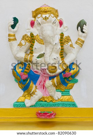 Indian God Ganesha or Hindu God Name Bhakti Ganapati avatar image in stucco low relief technique with vivid color,Wat Samarn temple,Thailand.