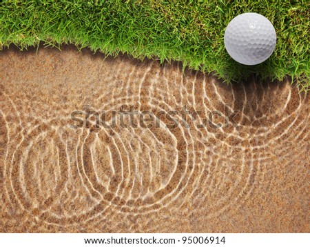 Golf ball on fresh green grass near water bunker in golf course