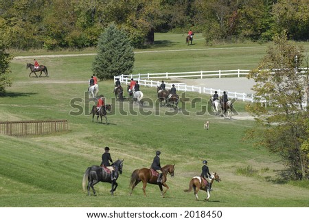 Riders in the country gather for a fox hunt.