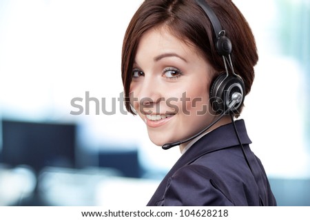 Portrait of a successful female call centre employee wearing a headset
