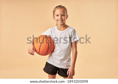 Cheerful child in ball pit