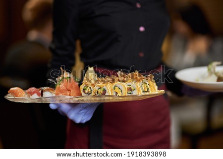 Similar – Image, Stock Photo Crop Asian waitress serving burger in cafe